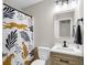 Well-lit bathroom featuring a modern vanity, decorative shower curtain, and sleek fixtures at 334 Water Oak Dr, Goose Creek, SC 29445