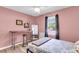 Stylish pink bedroom with a window, desk, and full-length mirror at 334 Water Oak Dr, Goose Creek, SC 29445