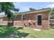 Rear exterior of a brick home with lawn, showing the access door at 334 Water Oak Dr, Goose Creek, SC 29445