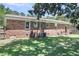 Rear exterior of a brick home with lawn and tree at 334 Water Oak Dr, Goose Creek, SC 29445