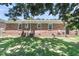Rear exterior of a brick home with lawn at 334 Water Oak Dr, Goose Creek, SC 29445