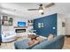 Well-lit living room showcasing a modern fireplace, floating shelves, cozy furniture, and vinyl flooring at 334 Water Oak Dr, Goose Creek, SC 29445