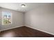 Empty bedroom with hardwood floors, a window, and neutral paint at 354 Iveson Rd, Summerville, SC 29486