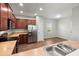 Well-lit kitchen featuring stainless steel appliances, wooden cabinets, and laminate countertops at 354 Iveson Rd, Summerville, SC 29486