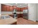 Well-lit kitchen featuring stainless steel appliances, wooden cabinets, and laminate countertops at 354 Iveson Rd, Summerville, SC 29486
