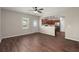 Open concept living room with hardwood floors and view into the kitchen area at 354 Iveson Rd, Summerville, SC 29486