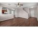 Open concept floor plan with hardwood floors, a staircase, and view into the kitchen at 354 Iveson Rd, Summerville, SC 29486