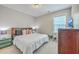 Cozy bedroom with a wooden headboard, comfortable bed, and a side table with drawers at 359 Whispering Breeze Ln, Summerville, SC 29486