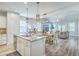 Open concept kitchen and dining area featuring granite counters and stainless steel appliances at 359 Whispering Breeze Ln, Summerville, SC 29486