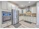 Bright kitchen with stainless appliances, beautiful backsplash and granite countertops at 359 Whispering Breeze Ln, Summerville, SC 29486