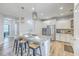 Modern kitchen island with seating, stainless sink, and pendant lighting at 359 Whispering Breeze Ln, Summerville, SC 29486