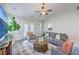 Comfortable living room with French doors, neutral tones, and stylish furnishings at 359 Whispering Breeze Ln, Summerville, SC 29486