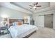 Well-lit main bedroom featuring a large bed, ceiling fan, and stylish bedside tables at 359 Whispering Breeze Ln, Summerville, SC 29486