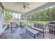 Relaxing screened porch with comfortable seating area overlooking the lush backyard at 359 Whispering Breeze Ln, Summerville, SC 29486