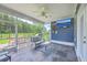 Covered porch with comfortable seating, a mounted TV, and views of the backyard at 359 Whispering Breeze Ln, Summerville, SC 29486