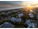 Breathtaking aerial view showcasing a neighborhood nestled along the coast with stunning sunset scenery at 4001 Palm Blvd, Isle of Palms, SC 29451