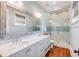 Beautiful bathroom featuring double sink vanity and large glass shower with tile accents at 4001 Palm Blvd, Isle of Palms, SC 29451