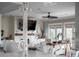 Open-concept living room featuring modern decor, TV, neutral colors, and lots of natural light at 4001 Palm Blvd, Isle of Palms, SC 29451