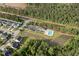 Aerial shot of community amenities including a pool, parking and wooded area at 404 Omaha Dr, Moncks Corner, SC 29461