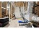 Unfinished basement featuring exposed wood beams, insulation, ductwork, and black storage containers at 404 Omaha Dr, Moncks Corner, SC 29461