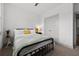 Comfortable bedroom with a bed, bedside table, and view of a closet at 404 Omaha Dr, Moncks Corner, SC 29461