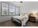 Cozy bedroom showcasing large windows, neutral walls, and a comfortable bed with decorative pillows at 404 Omaha Dr, Moncks Corner, SC 29461