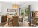Dining area showcasing modern lighting fixture and a sliding door access to the backyard at 404 Omaha Dr, Moncks Corner, SC 29461
