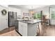 Bright kitchen area with an island, granite countertops, stainless steel appliances and access to dining area at 404 Omaha Dr, Moncks Corner, SC 29461