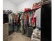 Spacious walk-in closet with ample hanging space and shelving for organization, filled with various clothing items at 404 Omaha Dr, Moncks Corner, SC 29461