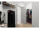 Organized walk-in closet featuring shelving, a Stack-On safe, and neutral walls and flooring at 404 Omaha Dr, Moncks Corner, SC 29461