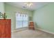 This bedroom features light green paint, carpet floors, and natural light from the window at 416 Prestwick Ct, Summerville, SC 29483