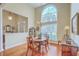 Dining room with large arched window, hardwood flooring, chandelier, and adjacent sitting area at 416 Prestwick Ct, Summerville, SC 29483