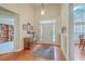 Spacious foyer with hardwood floors, large windows and a decorative rug and wooden accent table at 416 Prestwick Ct, Summerville, SC 29483