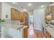 Bright kitchen features wooden cabinets, breakfast bar, tile backsplash, and stainless steel refrigerator at 416 Prestwick Ct, Summerville, SC 29483