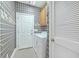 Laundry Room features built in cabinets, white washer and dryer and decorative wallpaper at 416 Prestwick Ct, Summerville, SC 29483