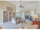 Spacious living room with a fireplace, built-in bookshelves, neutral color palette, and abundant natural light at 416 Prestwick Ct, Summerville, SC 29483