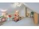 Upstairs living room with pitched ceiling, ceiling fan, comfortable furnishings, and large window at 416 Prestwick Ct, Summerville, SC 29483