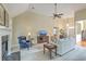 Large living room showcasing a fireplace, built-in bookshelves, and an open layout with hardwood flooring at 416 Prestwick Ct, Summerville, SC 29483