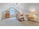 Upstairs living room with pitched ceiling, ceiling fan, comfortable furnishings, and large window at 416 Prestwick Ct, Summerville, SC 29483