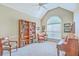 Stylish office area featuring arched window, vaulted ceiling, and beautiful hardwood desk and bookcase at 416 Prestwick Ct, Summerville, SC 29483