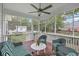 Inviting screened porch with comfortable seating and a ceiling fan, perfect for enjoying the outdoors at 416 Prestwick Ct, Summerville, SC 29483