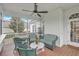 Relaxing screened porch with comfortable wicker furniture and ceiling fan perfect for outdoor living at 416 Prestwick Ct, Summerville, SC 29483