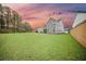 Expansive backyard showing lush green grass with the home's exterior at 436 Rowley Ln, Summerville, SC 29486