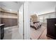 Well-lit bathroom next to the bedroom that features modern fixtures, marble floor, and a shower with patterned curtains at 436 Rowley Ln, Summerville, SC 29486