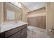 Comfortable bathroom featuring sleek modern vanity, marble floors, and a shower with neutral tone curtain at 436 Rowley Ln, Summerville, SC 29486