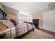 Bedroom featuring a plush bed with a blanket and decorative pillows, complemented by wood floors and natural light at 436 Rowley Ln, Summerville, SC 29486