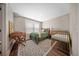 Bright bedroom featuring a bed, crib, desk, and area rug at 436 Rowley Ln, Summerville, SC 29486