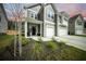 Two-story home featuring a welcoming front porch, tidy landscaping, and a spacious two-car garage at 436 Rowley Ln, Summerville, SC 29486