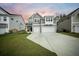 Two-story home with gray siding, a two-car garage, and a well-manicured lawn for great curb appeal at 436 Rowley Ln, Summerville, SC 29486
