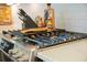 Close-up of the gas range stove with blue flames and stainless steel knobs at 436 Rowley Ln, Summerville, SC 29486